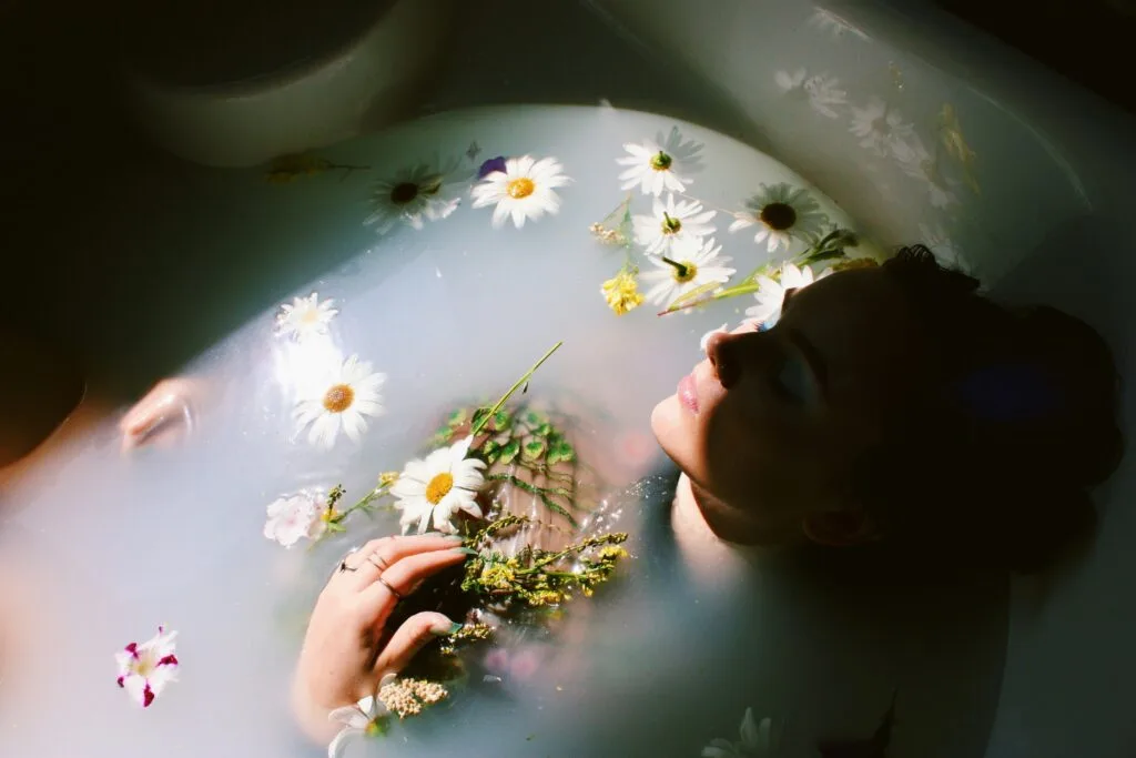 Woman bathing in a floral bath.